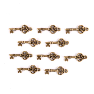 Fém díszítőelem, kulcs 2,5 x 0,8 cm, 10 db/csomag