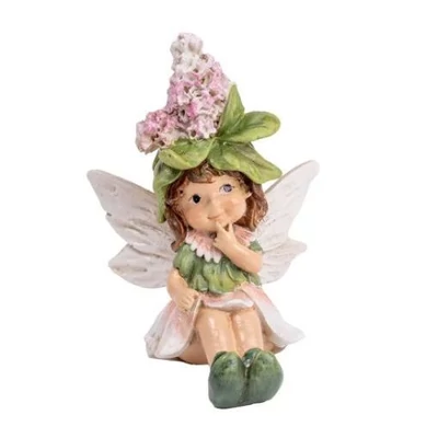 Bájos virágtündérke rózsaszín virágsapiban, ülő